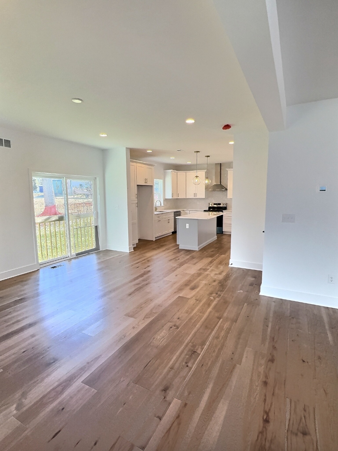 Worthington open concept living to kitchen with hardwood floors