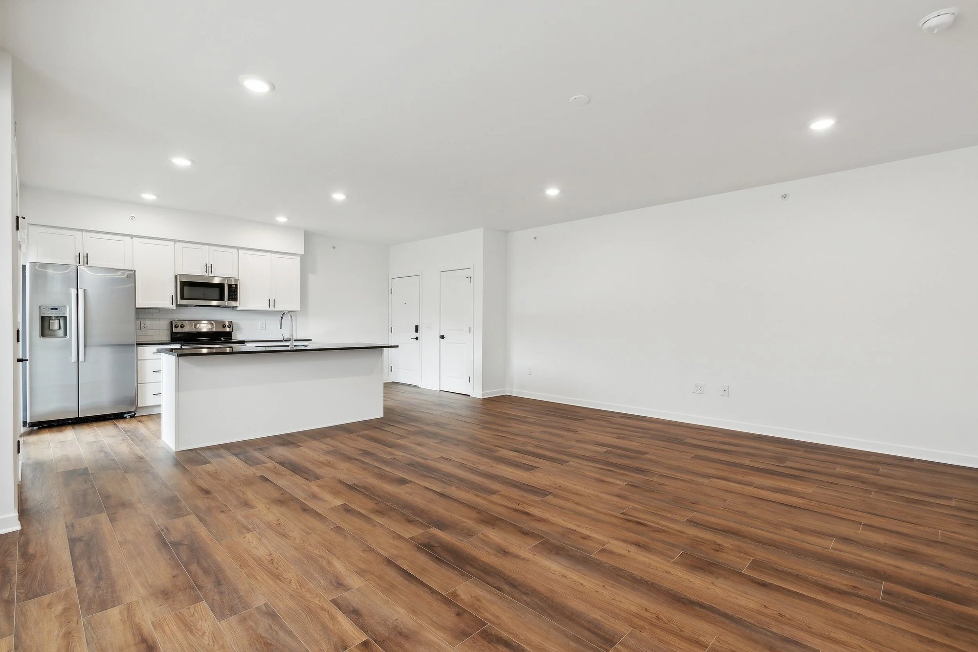 Living and dining area open to the kitchen with natural light